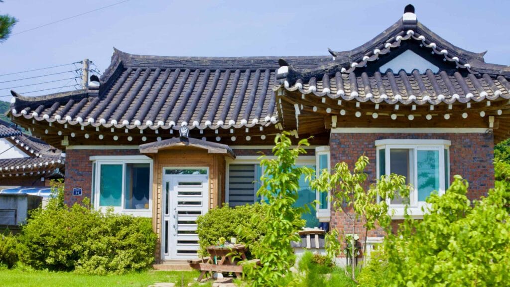 A contemporary Hanok-style house near Gajin Port features a traditional roof, complemented by a quaint yard.