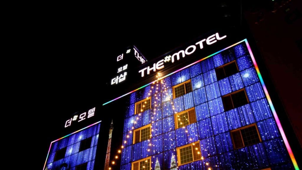 A picture of an illuminated love motel in South Korea.