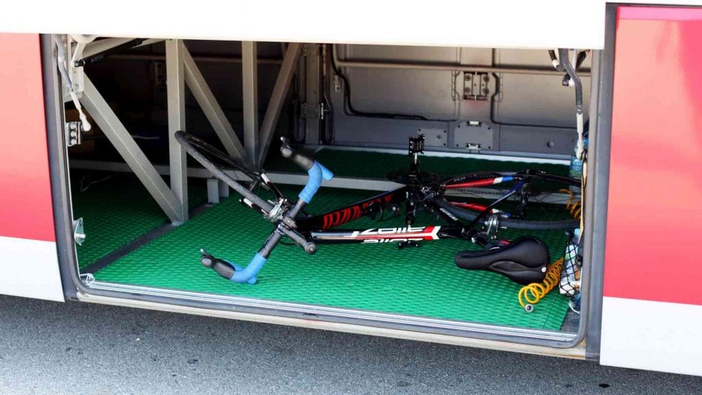 A picture of a bike in the luggage compartment of an intercity bus in Korea.