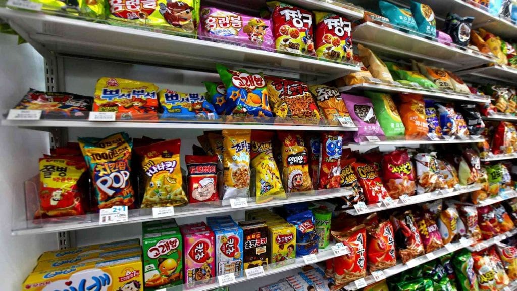Shelves full of potato chips at a convenience store in South Korea.