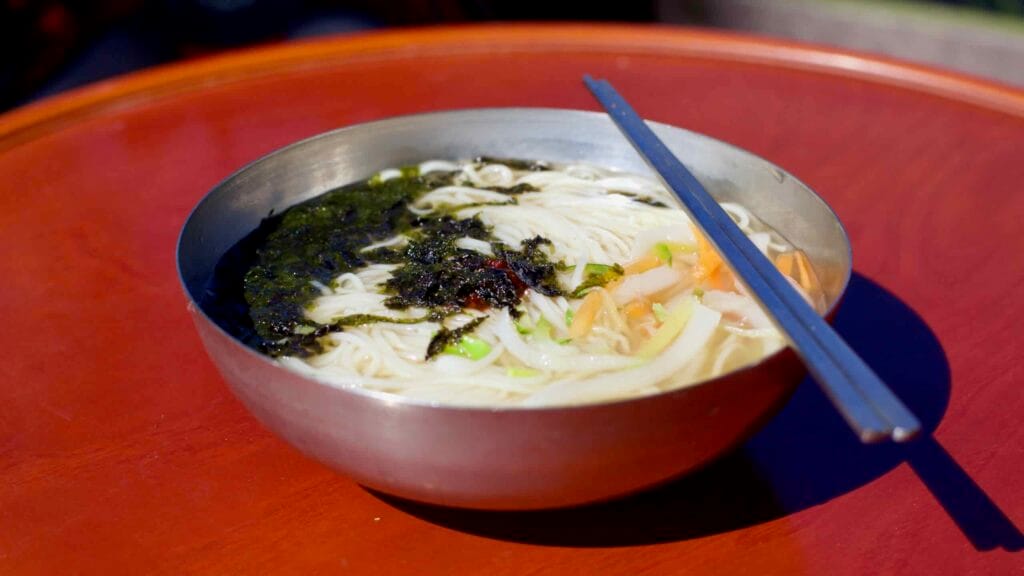 A bowl of myeolchi guksu, a traditional Korean anchovy noodle soup, at Damyang Noodle Street.