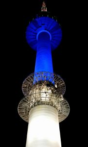 At night, Seoul splashes Namsan Tower with colorful light.