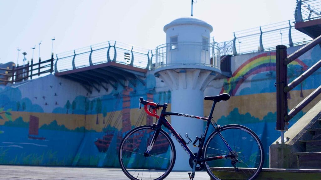 A bike leans against wooden stairs at the Yeongsanpo Floodgate.