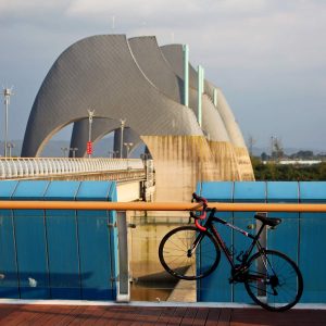 A bicycle leans against the railing at Seungchon Weir.