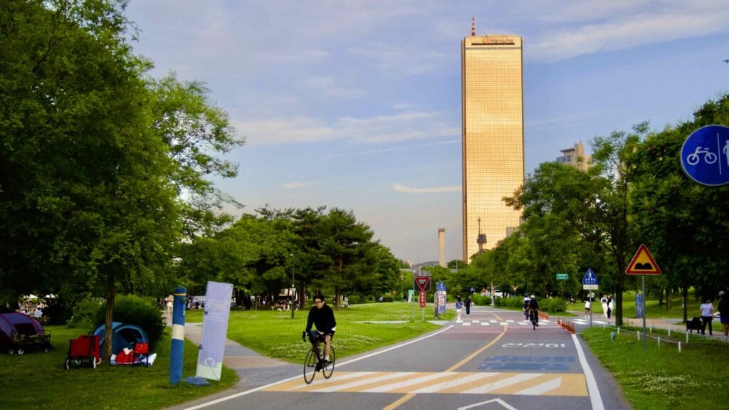 A picture of the cycling paths and 63 Building (63빌딩) in Yeouido Hangang Park (여의도한강공원) in Seoul, South Korea.
