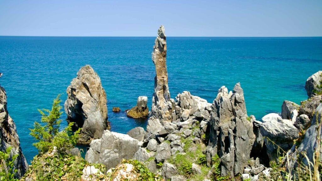 The Chuam Candlestick Rock stands tall against the backdrop of the blue East Sea.