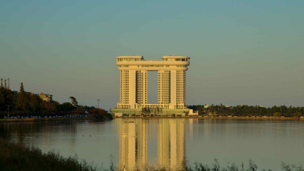 Skybay Hotel Gyeongpo is mirrored on the calm waters of Gyeongpo Lake, capturing the serene ambiance of this scenic area.