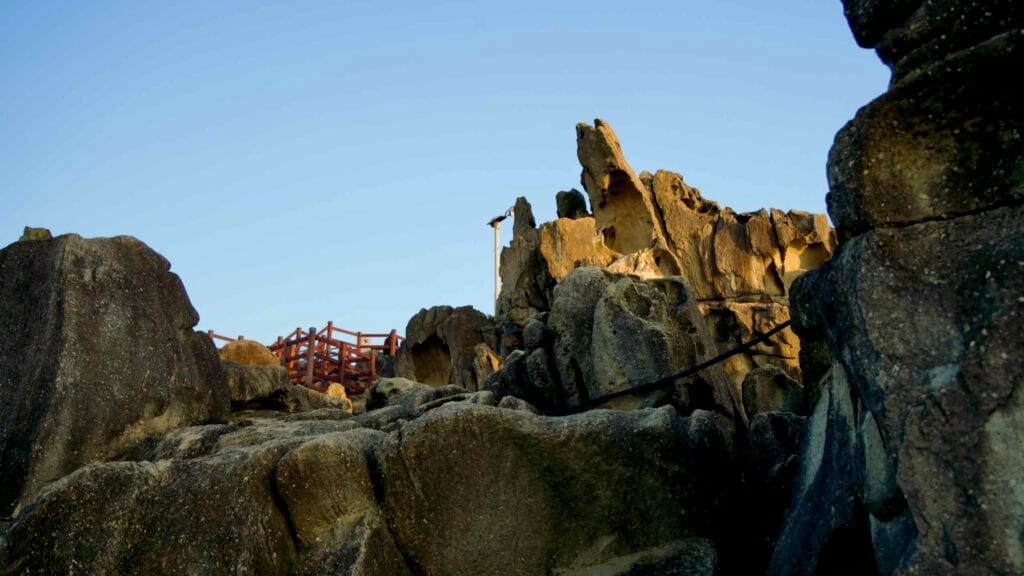 A upward view of the weathered rock formations of Neungpadae.