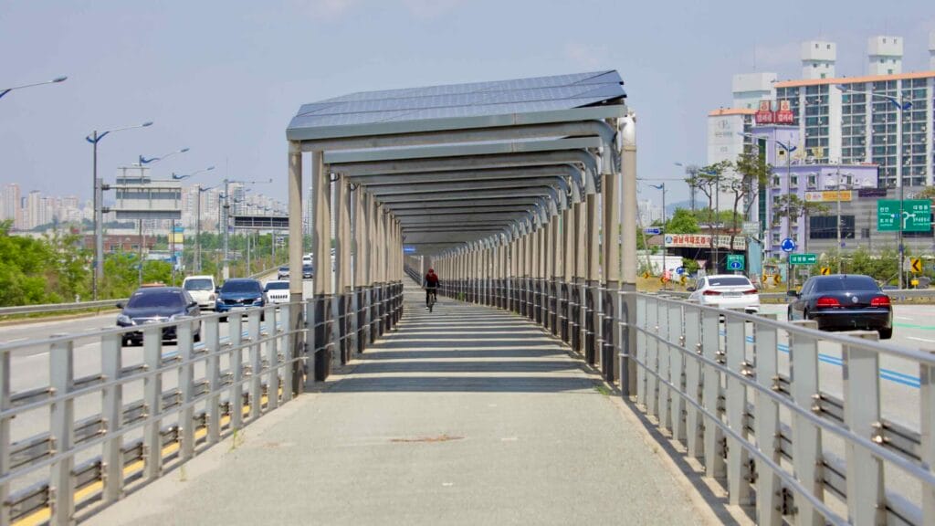 A cyclist rides along the solar-covered bike path on North Star Road.