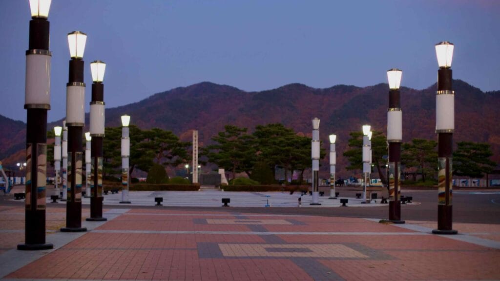 The courtyard at Daecheong Dam, featuring a symmetrical arrangement of modern lampposts.