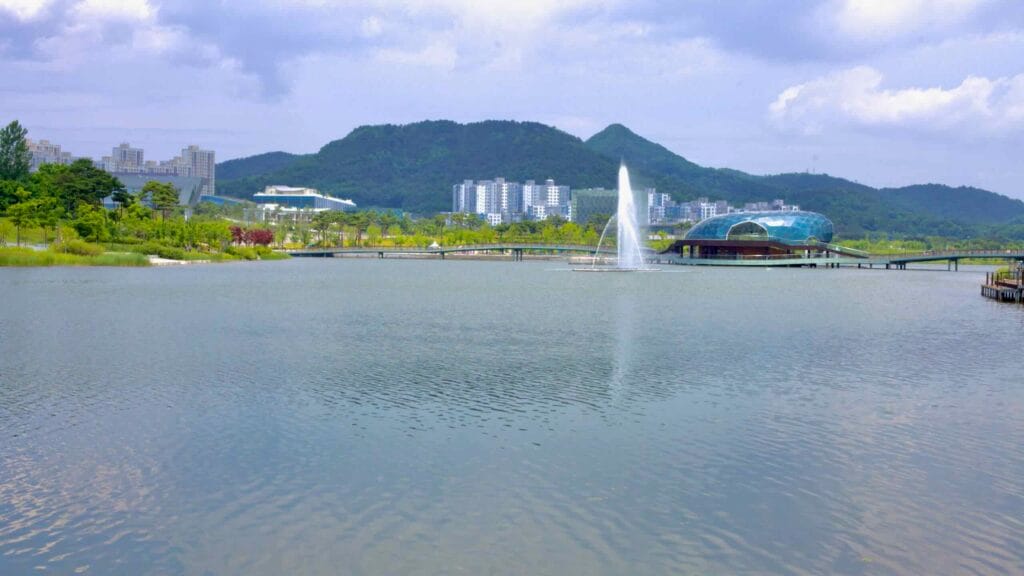 A fountain sprays into the artificial lake at Sejong Lake Park.