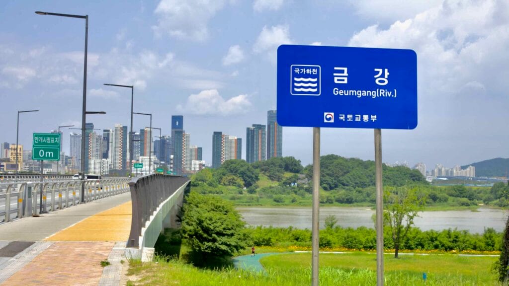A sign for the Geum River stands near Geumnam Bridge.