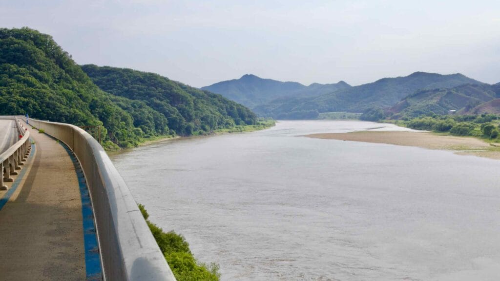 A sweeping view of the Geum River from a bike path bridge.