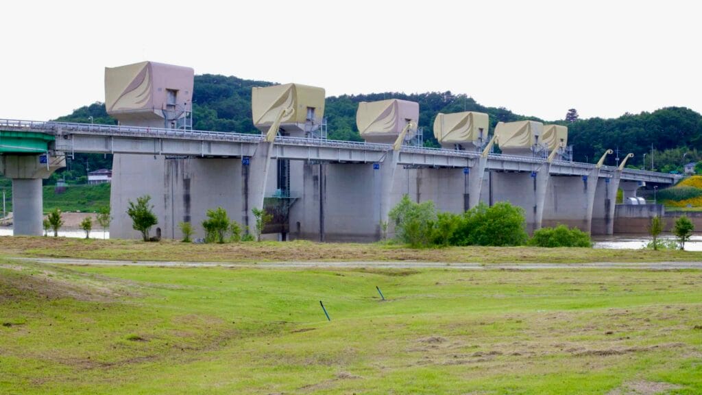 Gongju Weir, a modern hydraulic structure on the Geum River, featuring large movable gates.