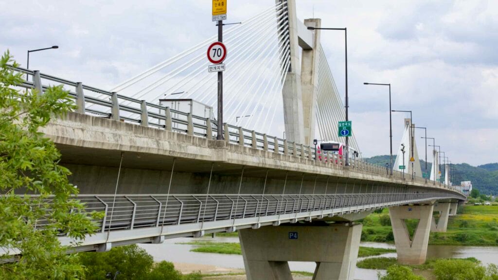 Vehicles travel across Haknara Bridge, a V-shaped extradosed bridge spanning the Geum River.