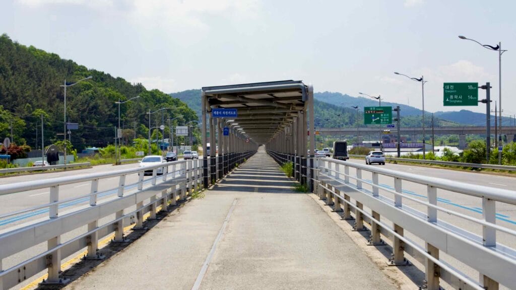 A bicycle path runs beneath solar panels along North Star Road, providing shade for cyclists.