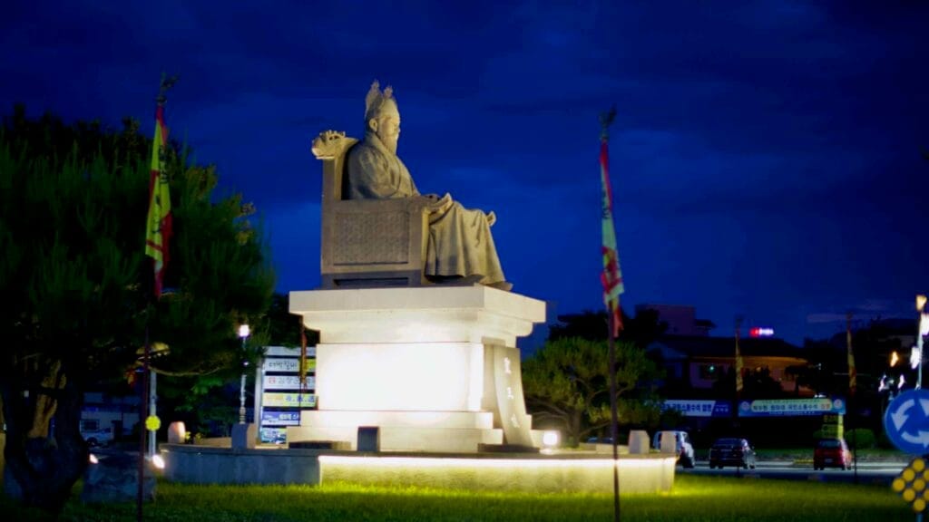 An illuminated statue of King Seong of Baekje stands at Sobangseo Rotary in downtown Buyeo.