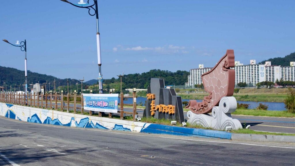 Entrance to Hongeo Street, marked by a sculpture, known for fermented skate cuisine.