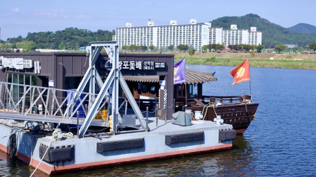 Traditional Hwangpo sailboat moored at Yeongsan Port, recalling maritime history.
