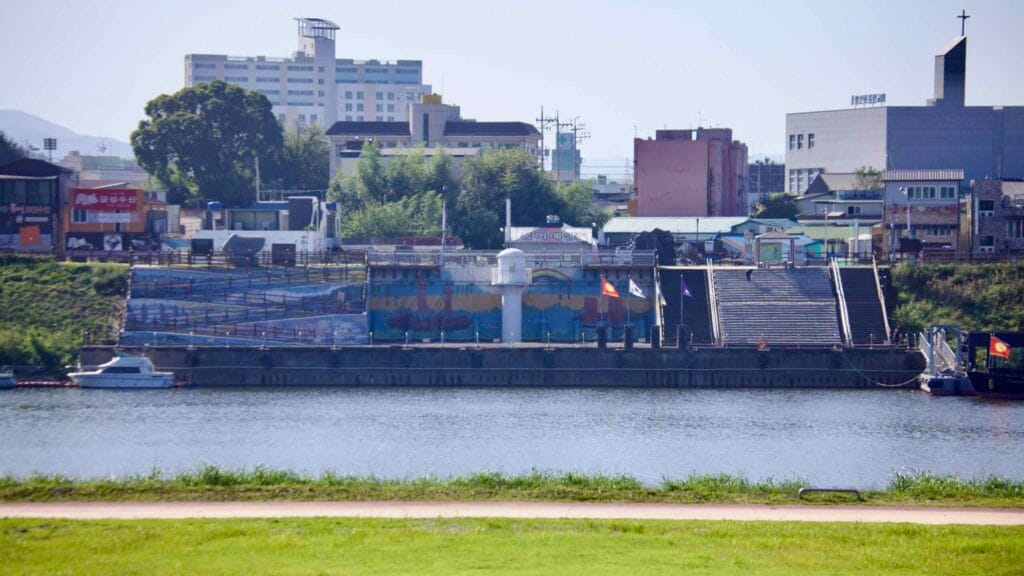 Yeongsan Port Lighthouse stands at the historic riverside landing, with colorful murals.