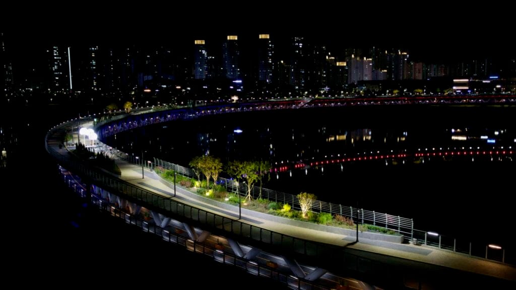 A night view of the circular Geumgang Pedestrian Bridge.