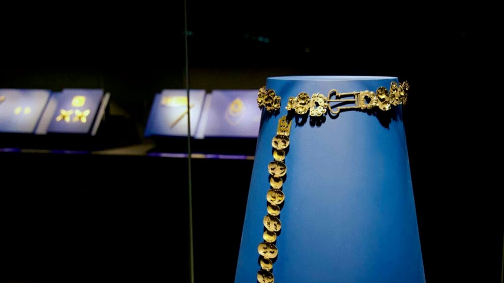 Baekje-era gold belt with ornate floral medallions displayed at Gongju National Museum.