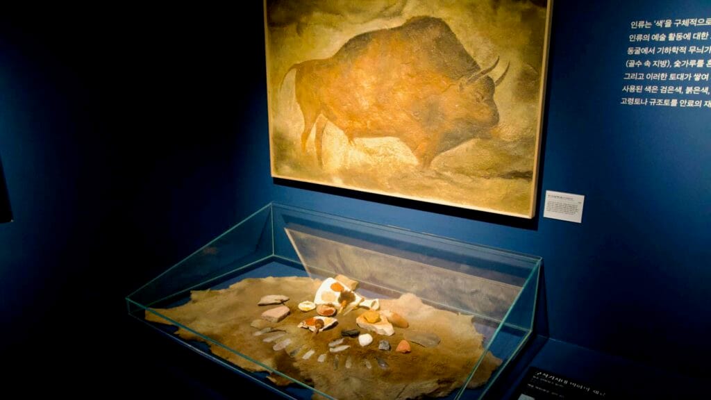 Natural pigments for cave painting with a bison mural replica at Seokjangni Museum.