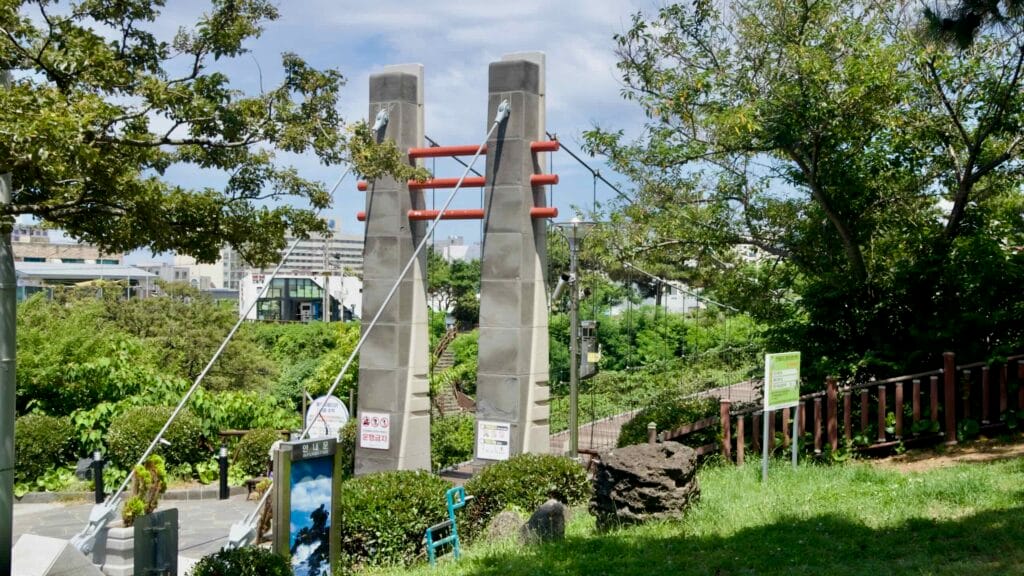 Entrance pylons and cables at Yongyeon Cloud Bridge, Jeju.