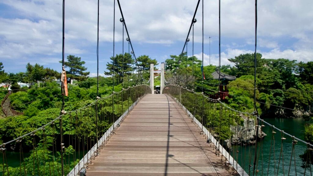 Center view along the wooden Yongyeon Cloud Bridge in Yongdam Park.