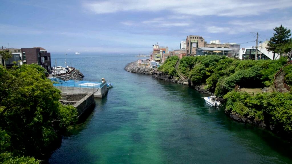 Yongyeon Valley’s channel opens toward the sea between rocky headlands.