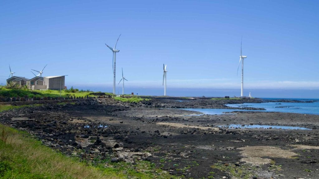 Low tide on basalt flats by Sinchang’s wind farm and breakwater.