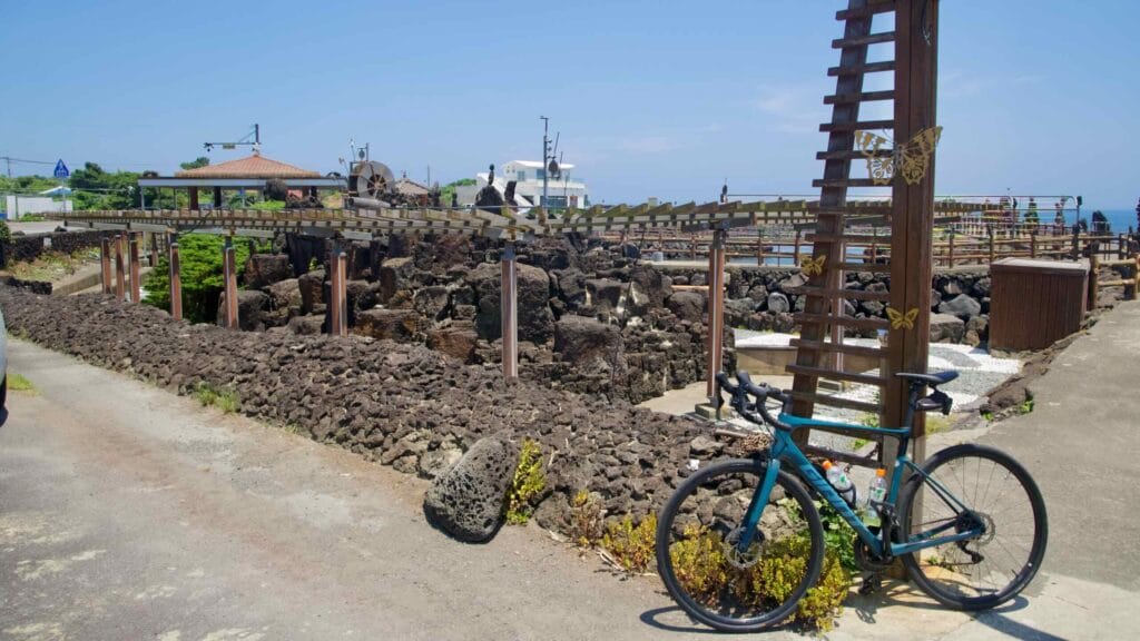 A bicycle leans at a seaside sculpture park in Onpyeong.