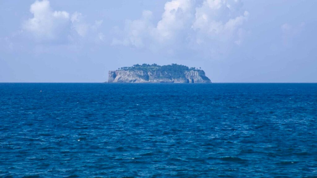 Munseom Island stands low on the horizon beneath summer clouds.