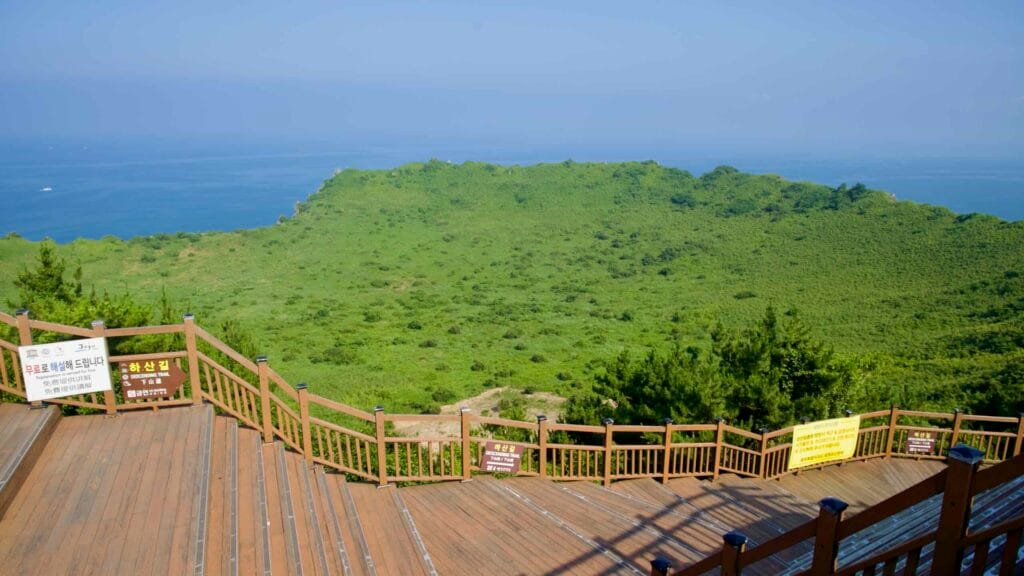 From the Seongsan Ilchulbong summit deck, a broad view opens over the green crater.