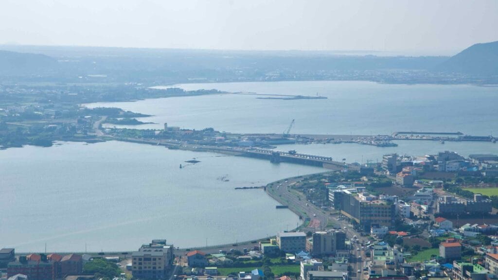 From the summit of Seongsan Ilchulbong, the causeway and harbor at Seongsan-ri.