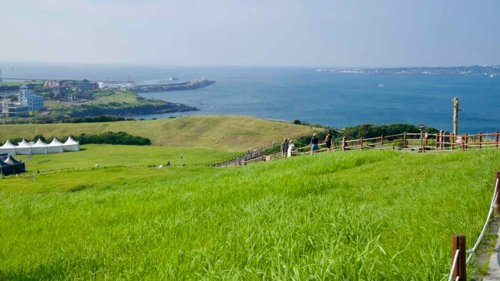 Green slopes roll down from Seongsan Ilchulbong toward the sea.