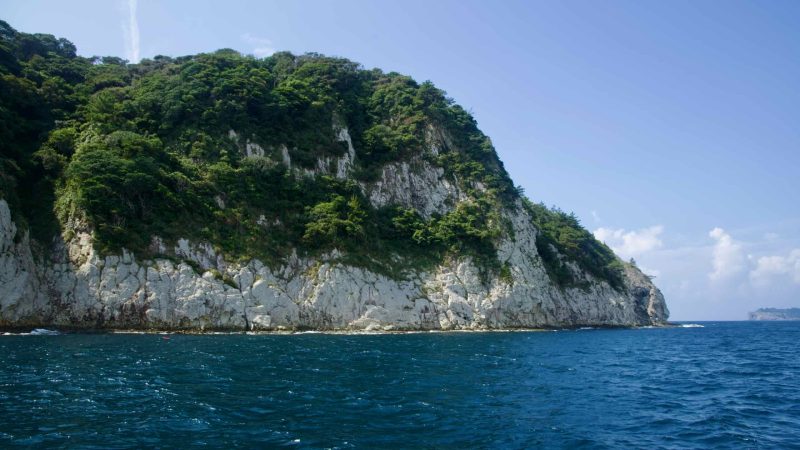 Munseom Island stands low on the horizon beneath summer clouds.