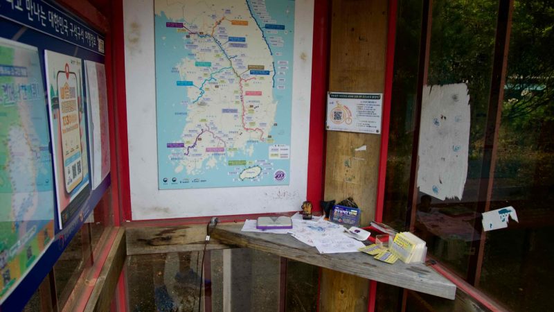 Inside the Buljeong certification booth, maps and stamp sheets fill the walls.