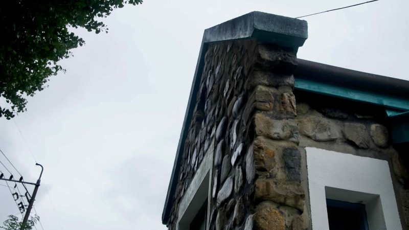 A close detail shows Buljeong Station’s fieldstone wall and window frame.