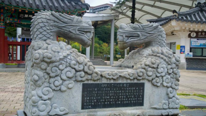 Carved dragon heads in Multang Park decorate a basin celebrating Suanbo’s mineral hot springs.