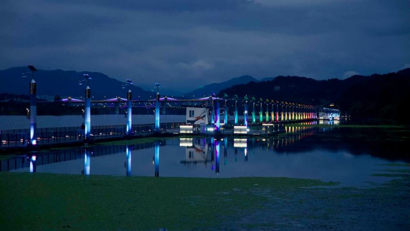 Color-changing LED pillars light the floating Rainbow Bridge near Jungangtap Park.