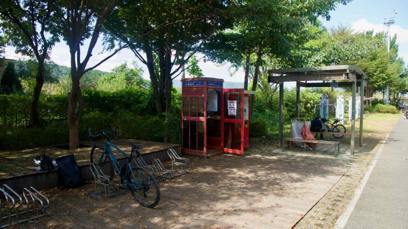 The Sinmae Bridge certification booth sits with a shelter and bike racks on the Bukhangang Bike Path.