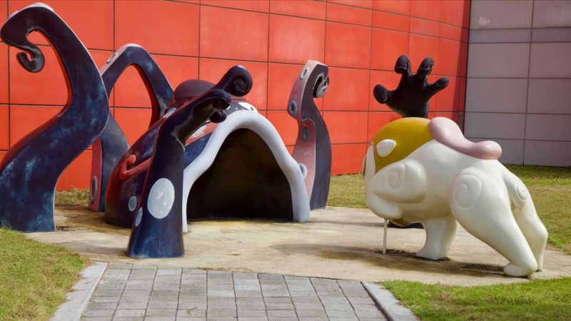 An octopus-themed tunnel and crouching character sculpture greet visitors outside the Animation Museum.