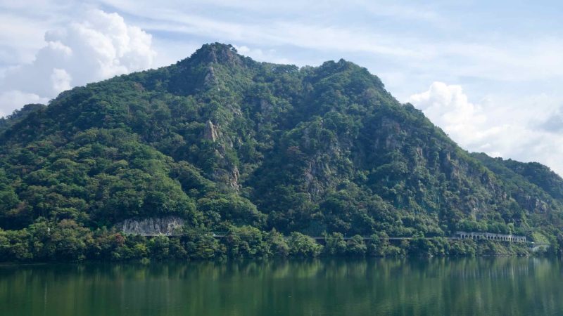 Samaksan’s rocky cliffs tower above Uiam Lake and old shoreline galleries.