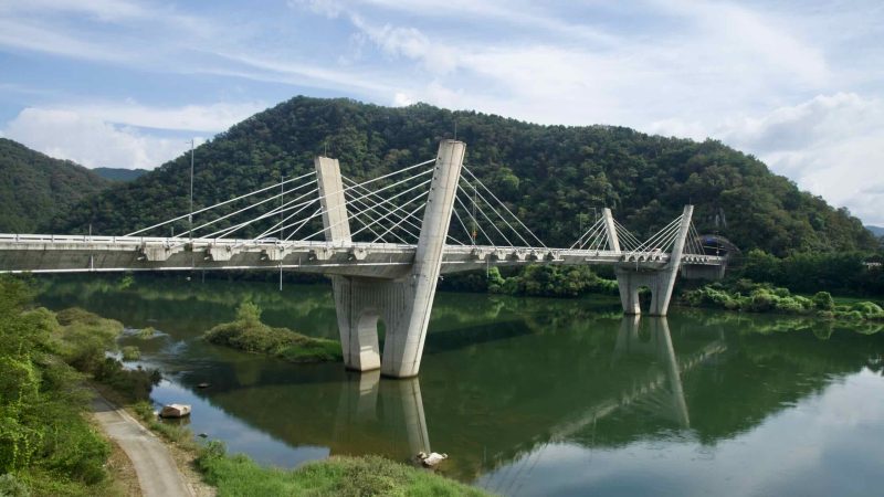 The Gangchon Grand Bridge reflects on calm Bukhangang water from an elevated view.