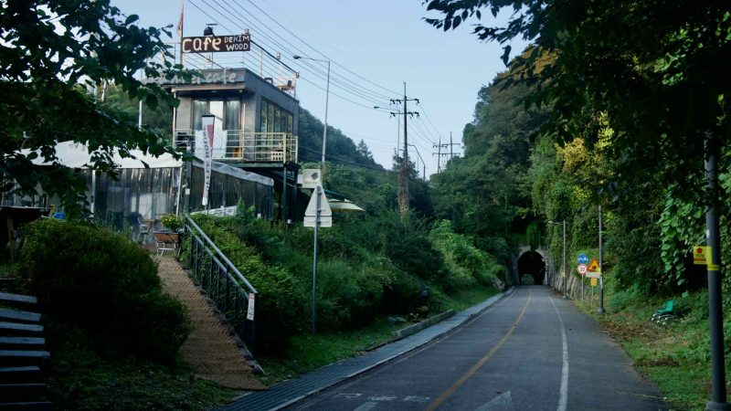Denim Wood café sits above the Bukhangang path near a tunnel entrance in Namyangju.