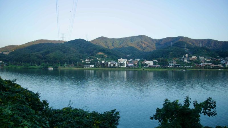 Low mountains rise beyond the North Han River at Namyangju.