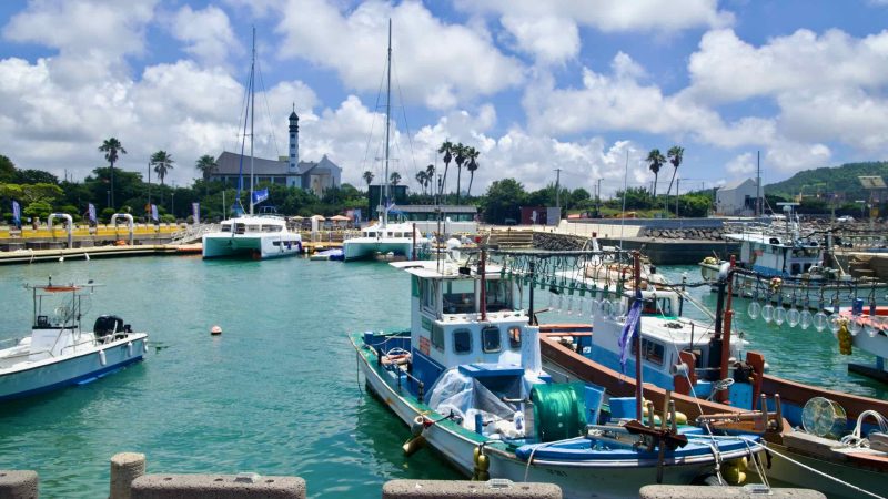 Boats at Yongsu Port with St. Kim Dae‑geon Memorial Church behind.