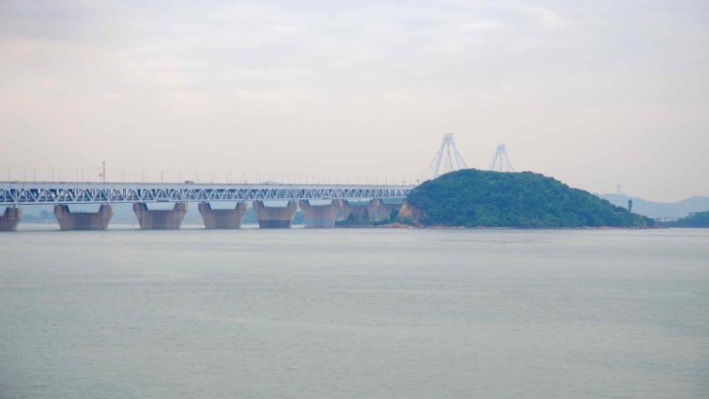The Yeongjong Bridge stretches across the Yellow Sea, linking the mainland to Yeongjong Island—home to Incheon International Airport—viewed from the Jeongseojin coast near the Ara Waterway.