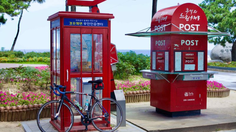 The unique Gyeongpo Beach Certification Center offers a stamp for bicycle passports beside a post office box on Gyeongpodae Beach.